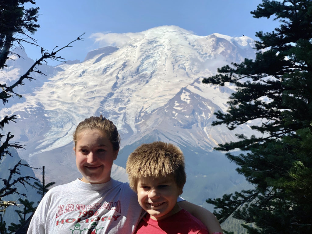 Kids posing at Mount Rainier overlook at Sunrise