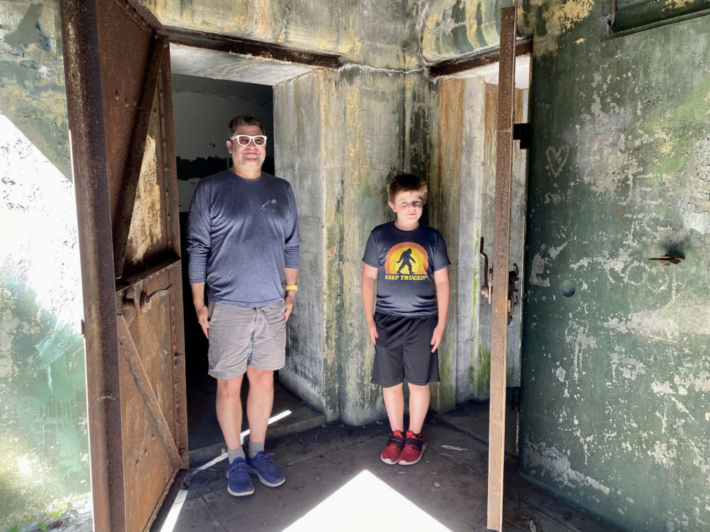 Me and my boy standing at attention in Fort Worden coastal defense artillery armament