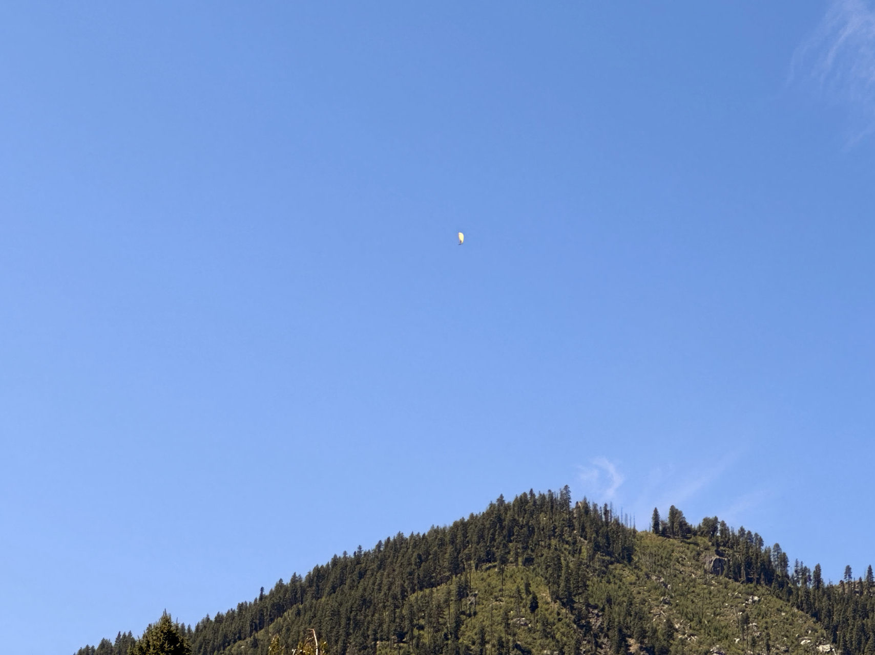 A paraglider soaring over Leavenworth, Washington